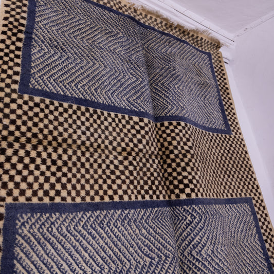 Handwoven Taznakht Moroccan Rug – 100% Wool Black & Beige Checkerboard with Intricate Blue Geometric Panels – Authentic Berber Craftsmanship